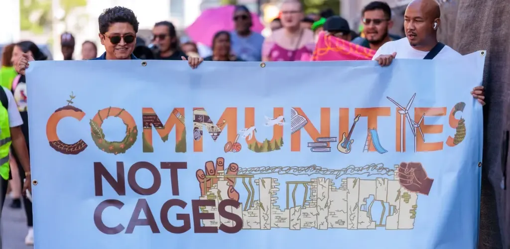 Communities Not Cages rally banner