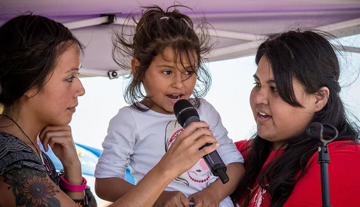 Child speaking at family detention protest